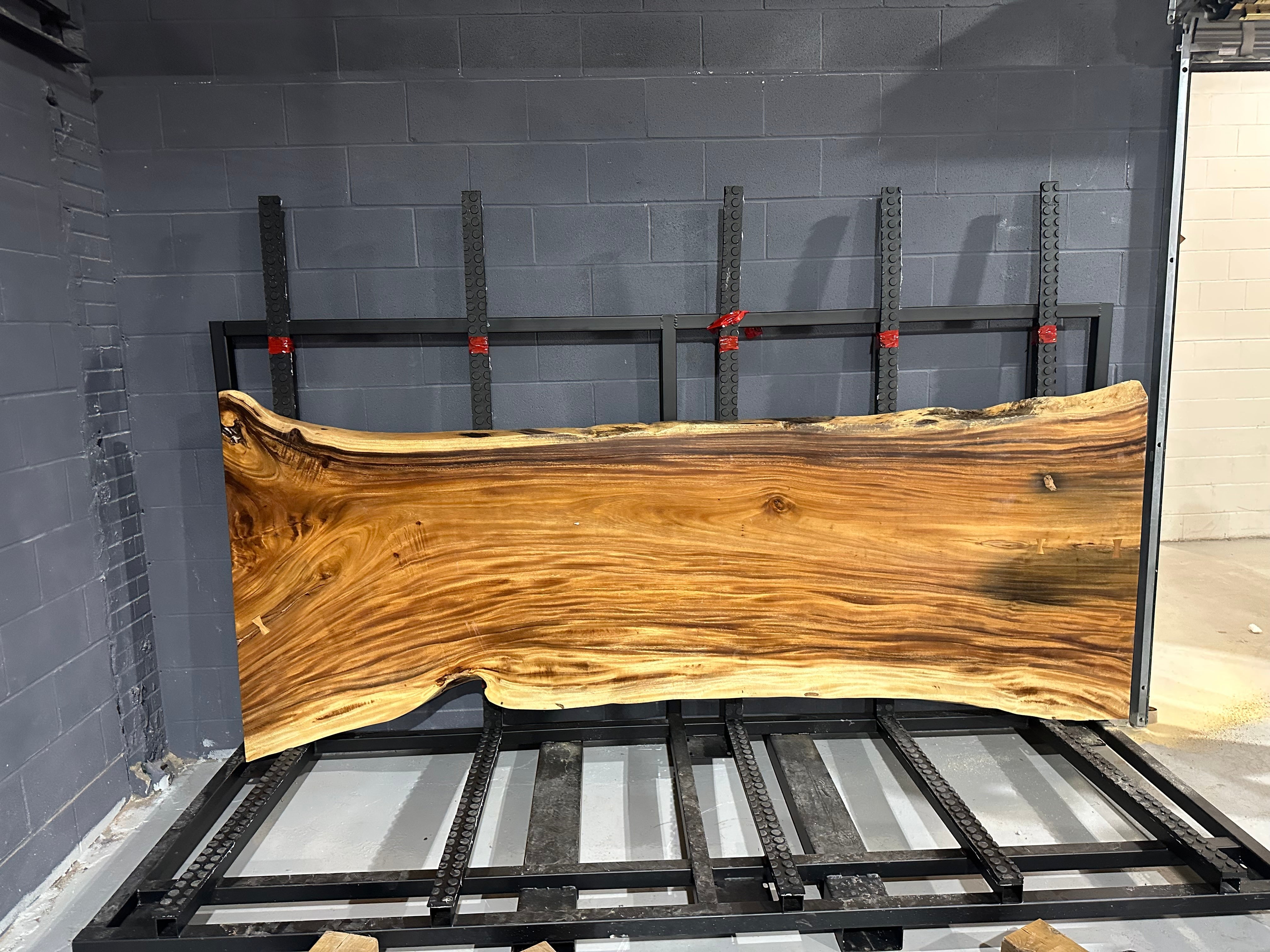 Image of - a live edge slab, long, wide, and thick.