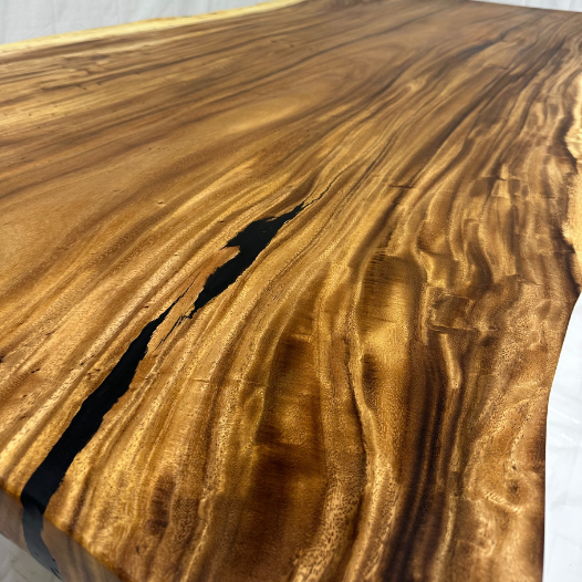 Image of  - a live edge  slab,  long,  wide, and  thick.