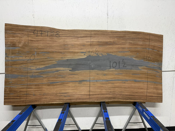 Parota live edge wood slab, 101.5x50 inches, large dining or conference table top on concrete floor.