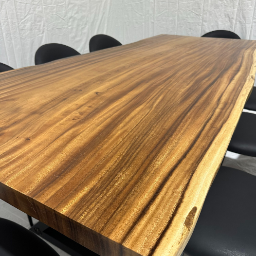 Image of  - a live edge  slab,  long,  wide, and  thick.